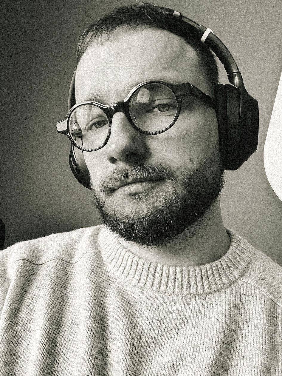 Andrej Kostal with glasses looking at you